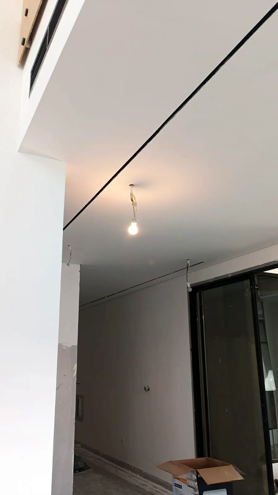 Corridor with recessed ceiling detail and aluminium glazing