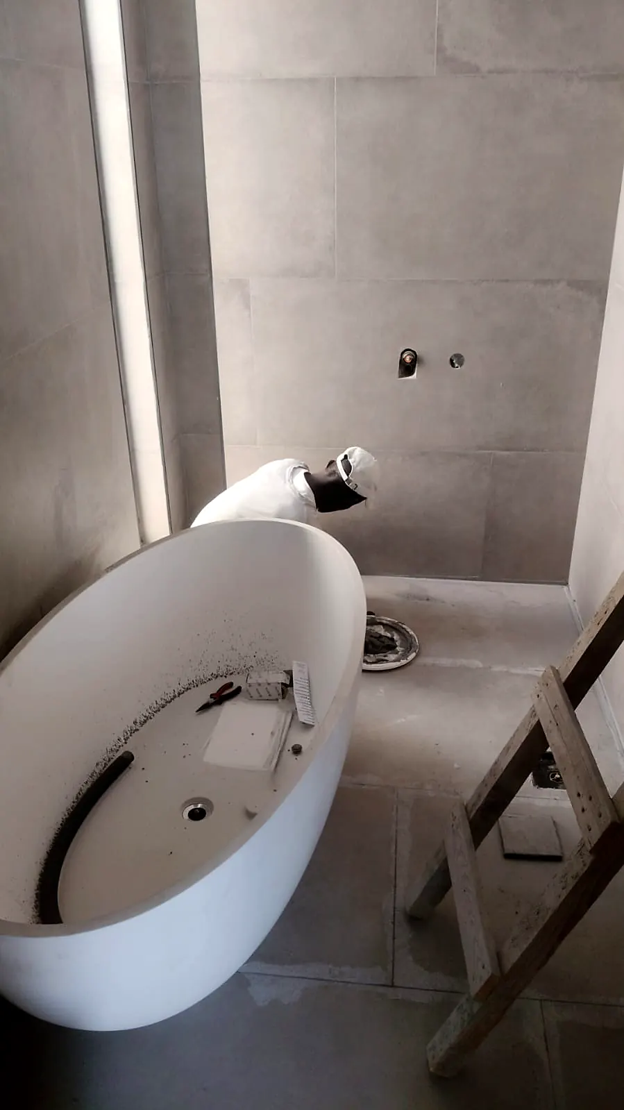 Freestanding bathtub positioned for installation