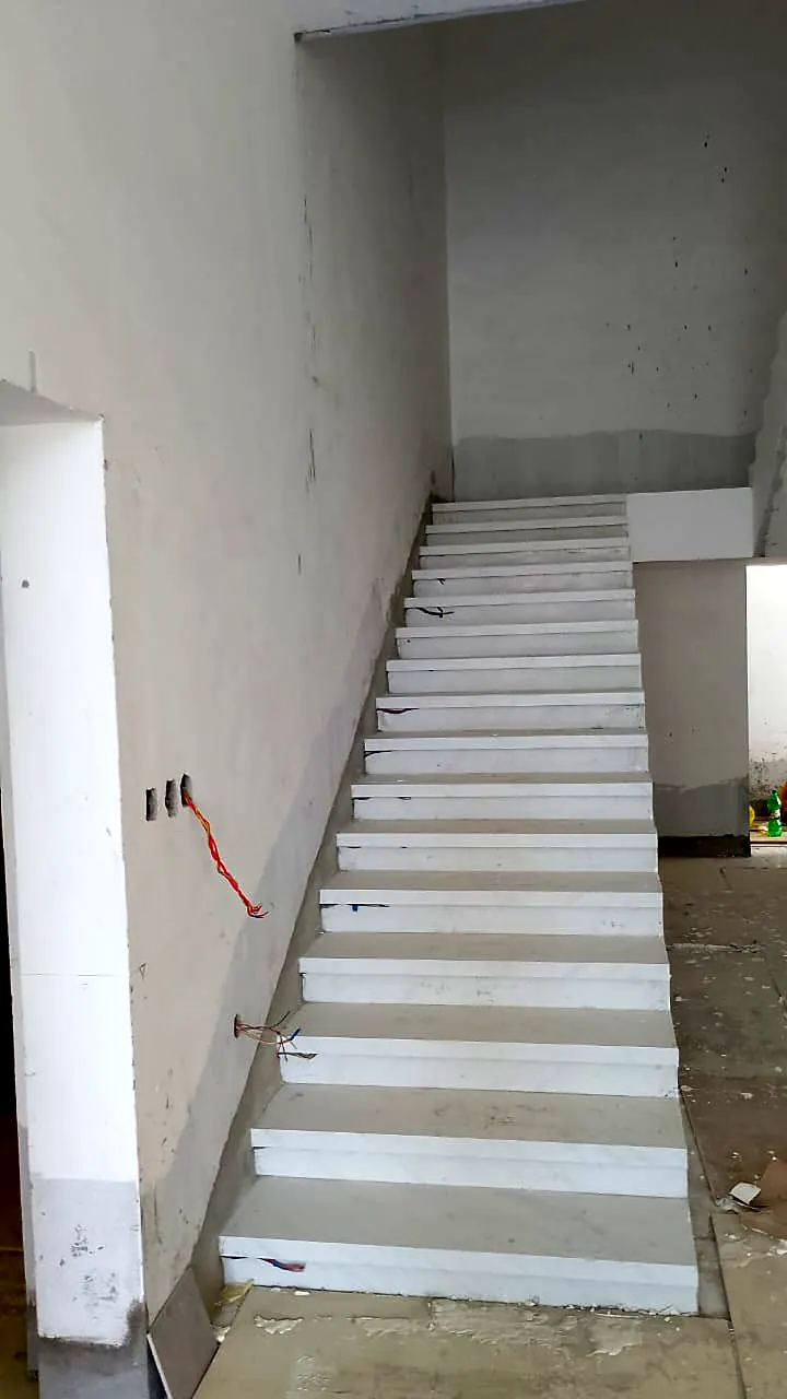 Straight staircase finished in light stone